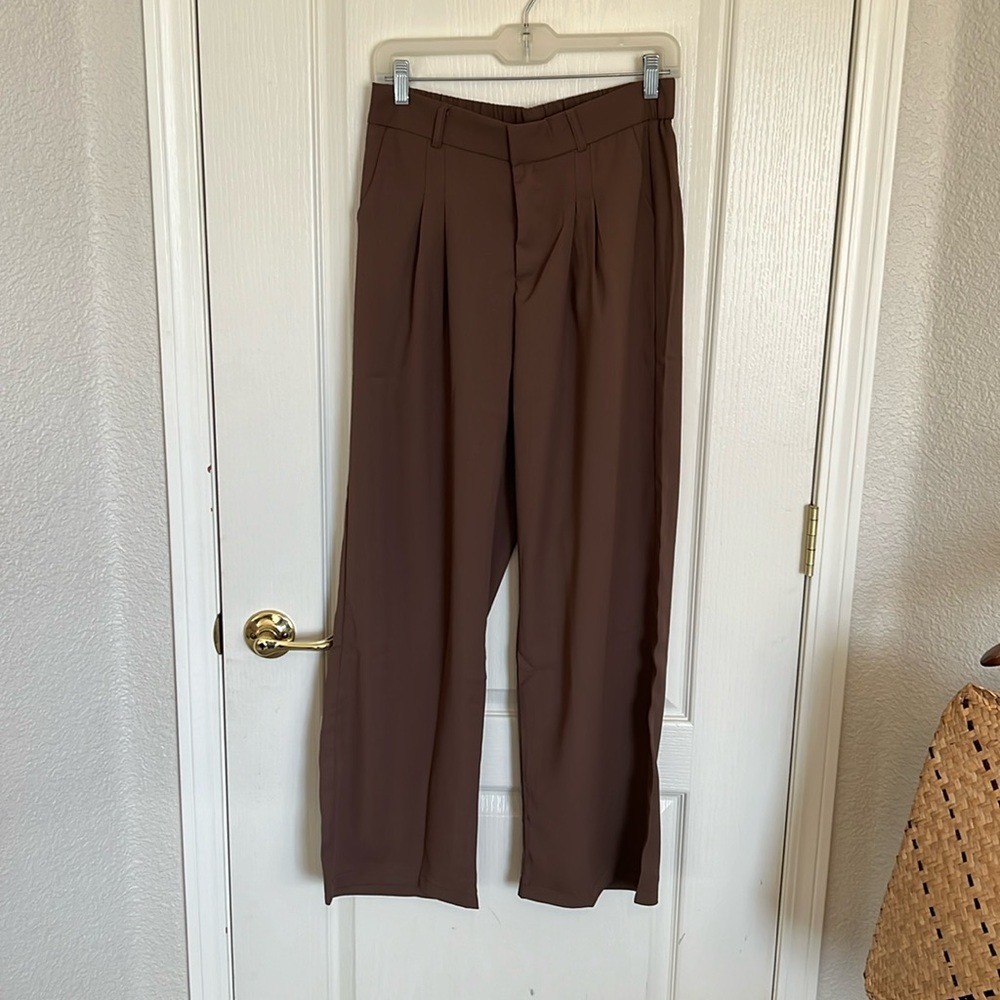 Trousers (wide leg) never worn! tag is L but fits more like a M.